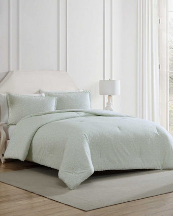Heirloom Ditzy Cotton Green Comforter Set on a bed in a room