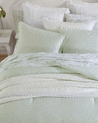 Heirloom Ditzy Cotton Green Comforter Set on a bed in a room closeup