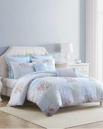 Hope Patchwork Pink Comforter Bonus Set on a bed in a bedroom setting