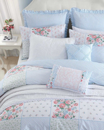 Hope Patchwork Pink Comforter Bonus Set on a bed