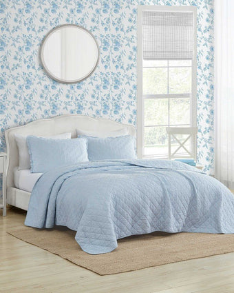 Oxford Stripe Blue Quilt Set on a bed in a romm setting