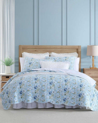 Peony Garden Blue Quilt Set on a bed in a room setting