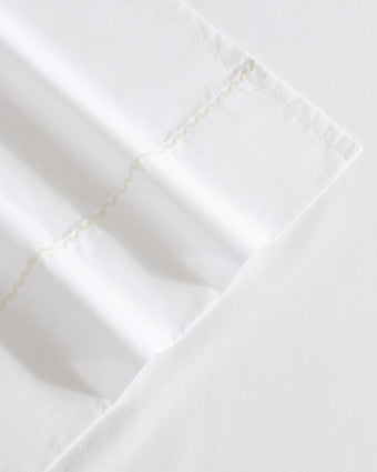Scallop Embroidered Cotton Ivory Sheet Set View of embroidered detail