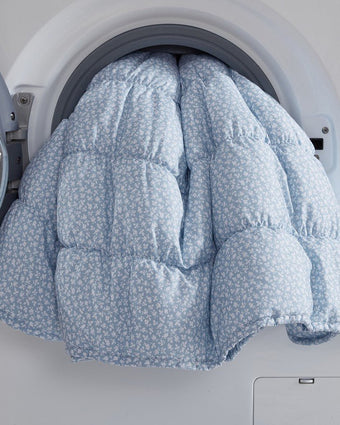 Amalia Microfiber Blue Quilt Set View of quilt in a dryer