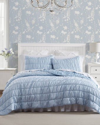 Amalia Microfiber Blue Quilt Set View of quilt and shams on a bed
