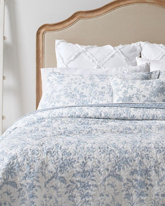 Amberley Bright Blue Reversible Quilt Bonus Set close up  view of quilt, 2 shams and 1 pillow cover