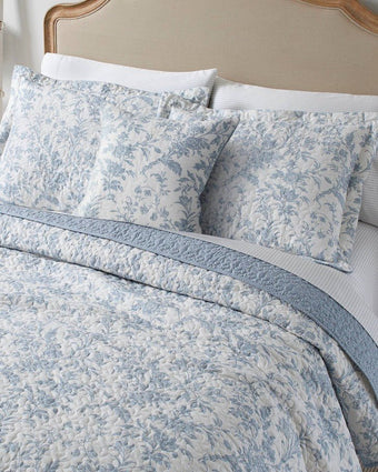 Amberley Bright Blue Reversible Quilt Bonus Set close up  view of quilt, 2 shams and 1 pillow cover