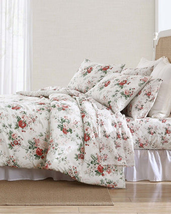 Ashfield Bright Red Cotton Flannel Reversible Comforter Set side view of comforter on a bed