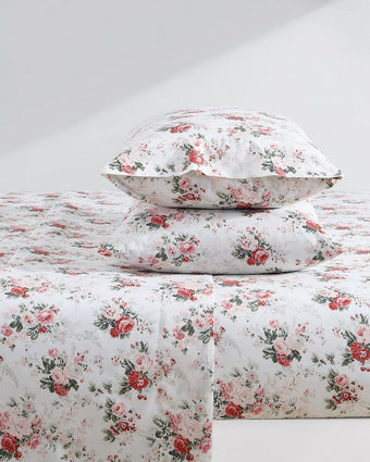Ashfield Pink Cotton Percale Sheet Set view of pillowcases and sheets on a bed
