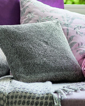Beaded Silver Cushion Close Up in Front of Cushion
