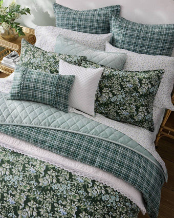 Bramble Floral Green Comforter Bonus Set - Close up view of comforter and pillows on a bed