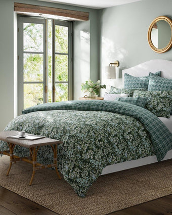 Bramble Floral Green Duvet Cover Bonus Set - View of duvet cover, shams, and pillows on a bed