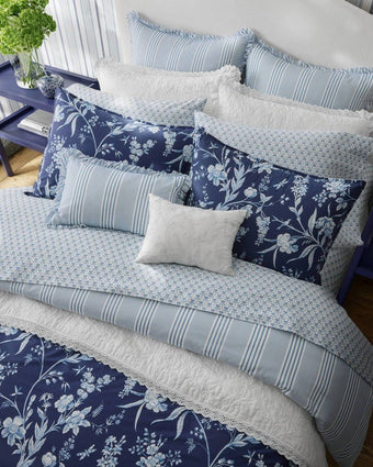 Branch Toile Blue Comforter Bonus Set - View of comforter and pillows on a bed