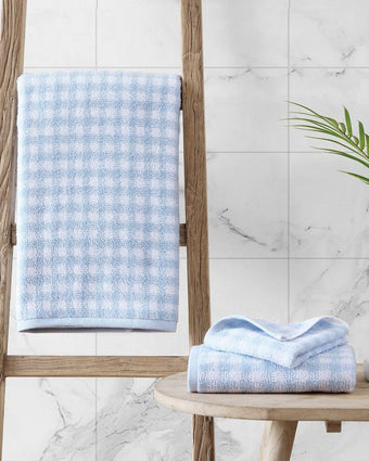 Ginny Blue Cotton Terry 3 Piece Towel Set - View of bath towel hanging and folded hand towel and wash cloth