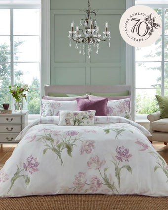 Gosford Grape Duvet Cover Set on a bed in a bedroom with windows