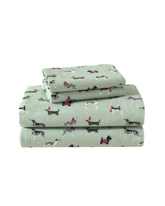 Holiday Pups Green Cotton Flannel Sheet Set view of folded sheets and pillowcases