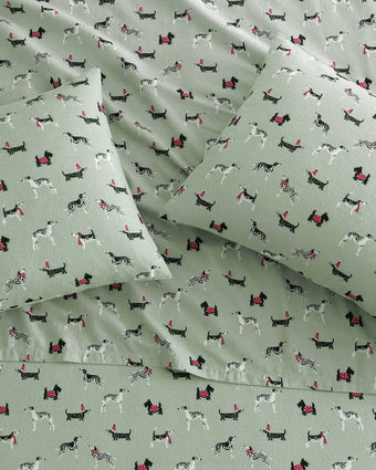 Holiday Pups Green Cotton Flannel Sheet Set view of sheets and pillowcases