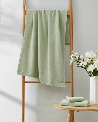 Juliette Lace Hem Green 3 Piece Towel Set Lifestyle view of hanging towel 