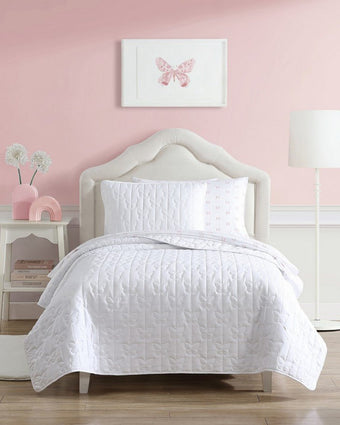 Kids Butterfly Kiss White Microfiber Reversible Quilt Set - View of quilt and sham on a bed