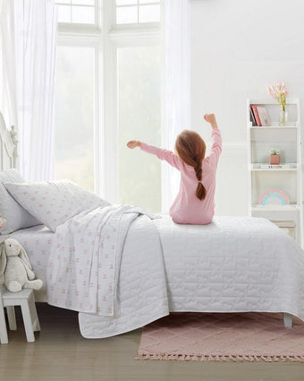 Kids Butterfly Kiss White Microfiber Reversible Quilt Set - View of quilt and sheets on a bed