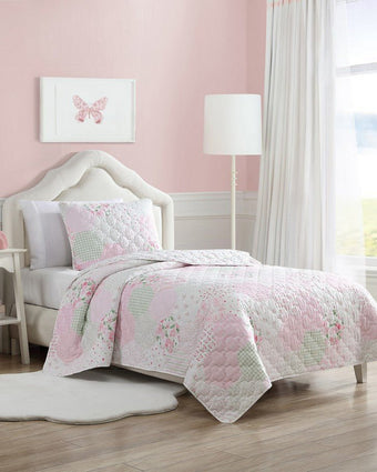 Kids Ellyn Pink Microfiber Reversible Quilt Set - View of quilt set on a bed