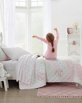 Kids Mae Pink Microfiber Sheet Set - View of sheets and quilt on a bed