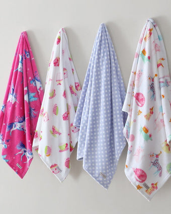 Laura Ashley Kids Sweet Treat Ultra Soft Plush Fleece Throw view of available prints hanging on a wall
