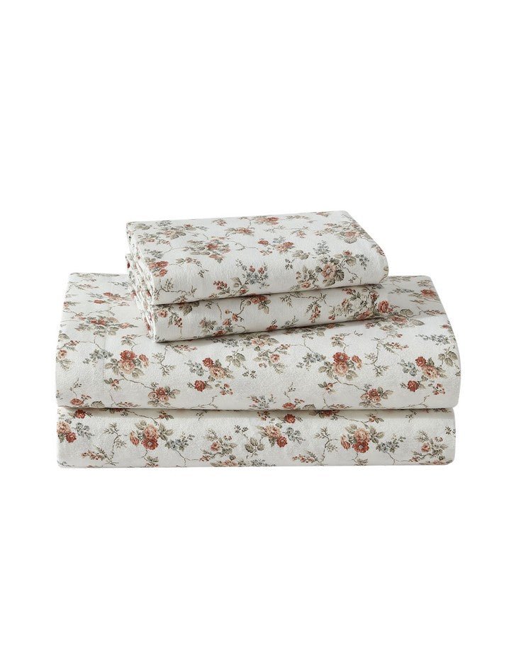 Le Fleur Orange Cotton Flannel Sheet Set view of folded sheet set and 2 pillowcases