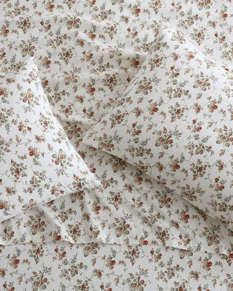 Le Fleur Orange Cotton Flannel Sheet Set view of sheet and pillowcases