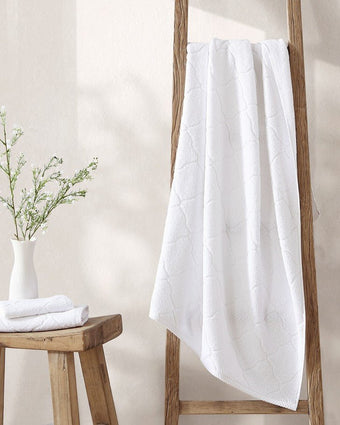 Maude Solid Jacquard White Quick Dry Cotton Terry 6 Piece Towel Set - View of hanging towel