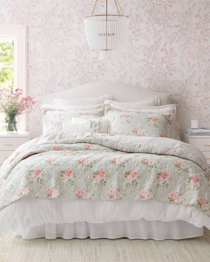 Melany Pink Quilt Set - Full view of quilt and shams on a bed