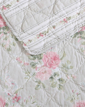 Melany Pink Quilt Set - View of front side and reverse side of quilt