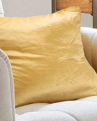 Nigella Camomile Velvet Cushion - View of cushion on a chair