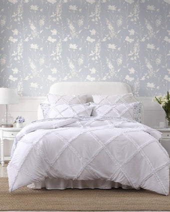 Norah White Microfiber Comforter Set  View of comforter on a bed