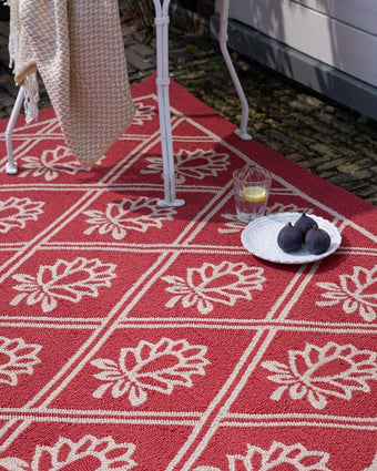 Porchester Poppy Red Indoor Outdoor Rug view of rug outside