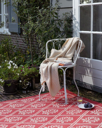 Porchester Poppy Red Indoor Outdoor Rug view of rug outside