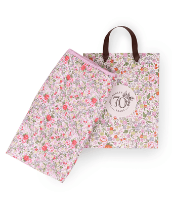Rowena Crinkle Gauze Receiving Blanket and Gift Bag  View of folded blanket and gift bag.