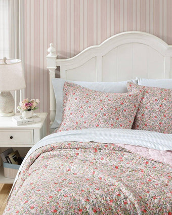 Rowena Pink Quilt - Close up view of quilt and shams on a bed
