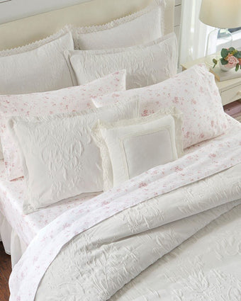 Rowland White Matelasse Duvet Cover Set - View of shams and available pillows