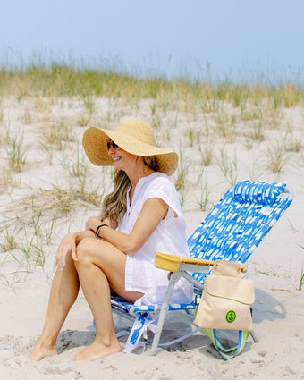 Sandbar Low Backpack Beach Chair Sea Buoy with a model sitting on the beach