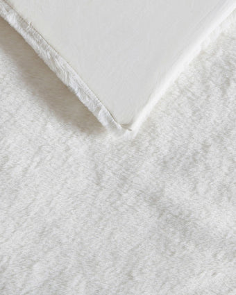 Solid Faux Fur Natural Duvet Cover Set - Close up view of duvet cover hem