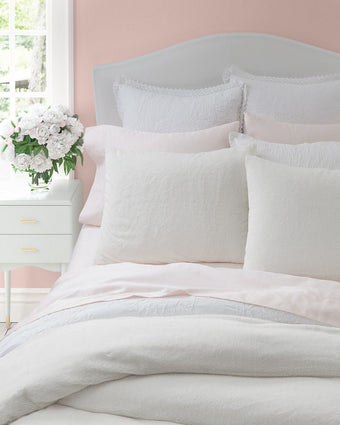 Solid Faux Fur Natural Duvet Cover Set - Close up view of shams on a bed