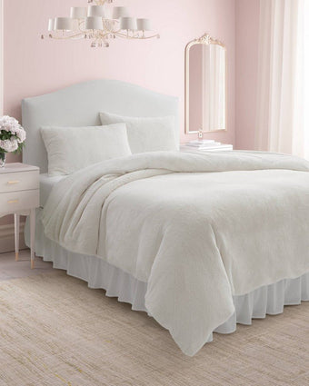 Solid Faux Fur Natural Duvet Cover Set - Angle view of duvet cover and shams on a bed