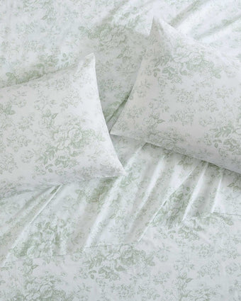 Toile Delight Green Cotton Percale Sheet Set with matching pillowcases on a bed