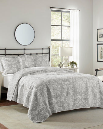 Venetia Grey Reversible Quilt Bonus Set angle view of quilt, 2 shams and 1 pillow cover