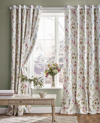Wild Meadow Crimson Grommet Blackout Ready Made Curtains - View of hanging curtains
