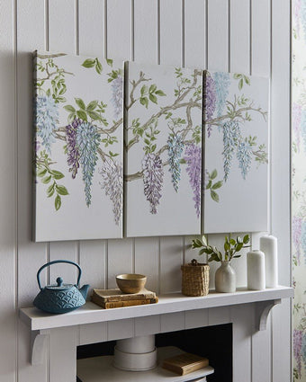 Wisteria Garden Printed Canvas Wall Art Set of 3. Hanging on wall.