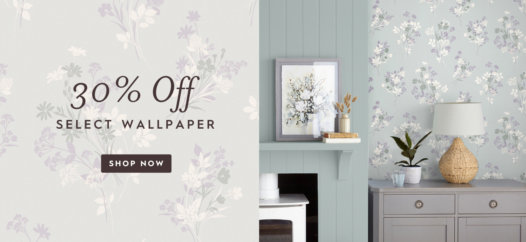 Igerna Pale Duck Egg Blue Wallpaper on wall above a chest of drawers with a fireplace and mantle on the left hand side with decor.